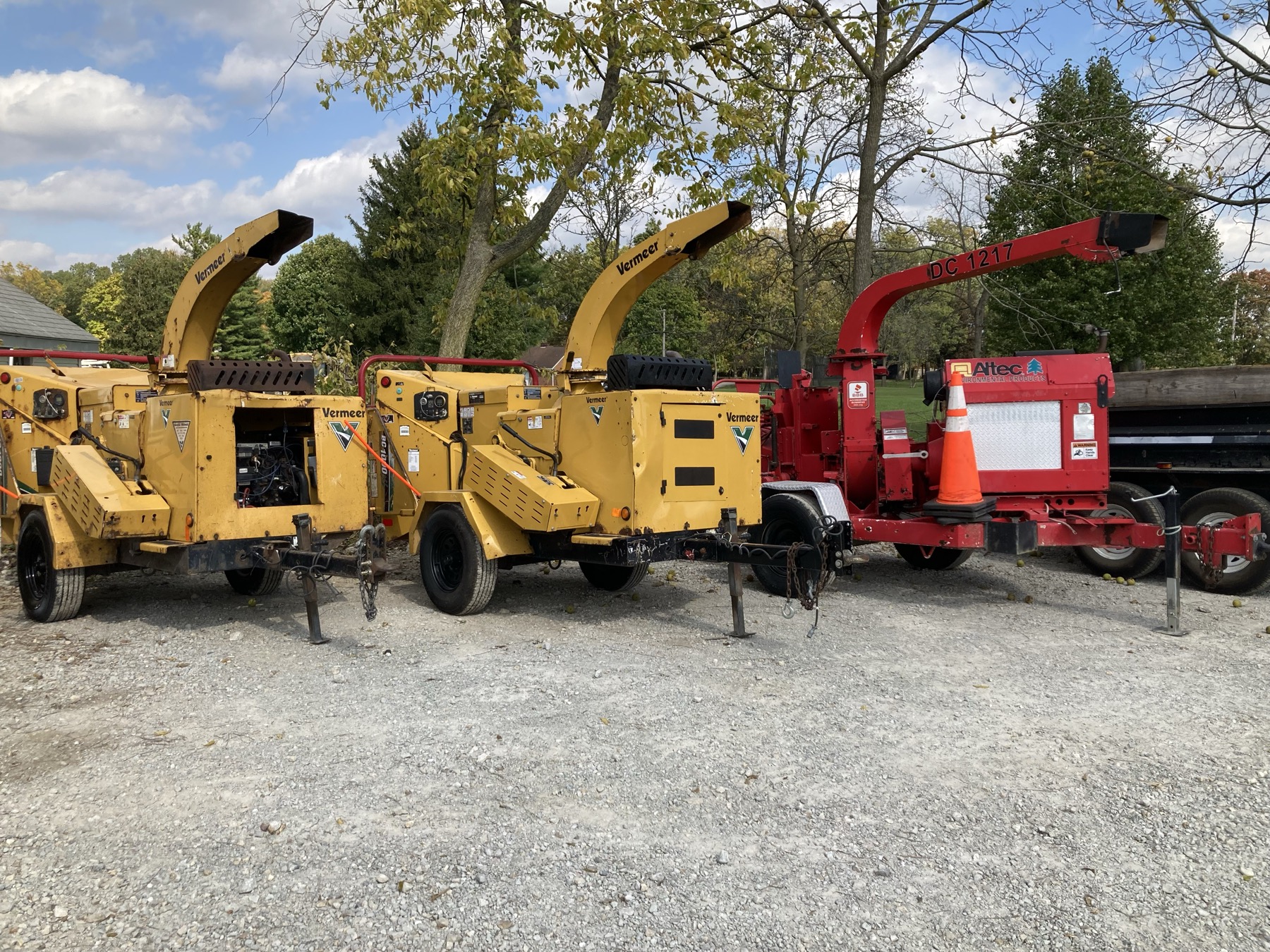 Wood chippers lined up at job site